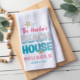 Beach house waffle tea towel with family name, date and city