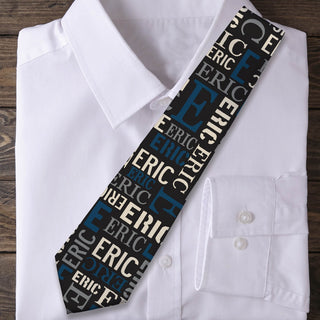 Neck tie with blue and gray name and initial