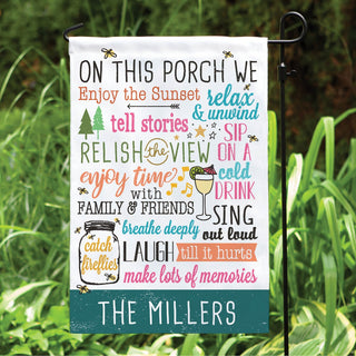 On this porch garden flag with family name