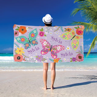 Colorful butterflies and flowers beach towel with name
