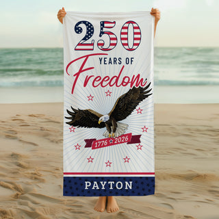Red, white, and blue beach towel featuring a soaring bald eagle and “250 Years of Freedom” patriotic design