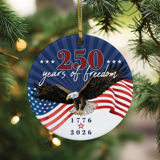A round ceramic ornament, depicting a patriotic theme with a bold eagle and American flag, honoring 250 years of freedom. 