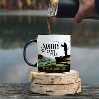 White travel mug with fisherman reading Sorry, I can't Talk, I'm on another line personalized with a name
