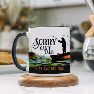 White travel mug with fisherman reading Sorry, I can't Talk, I'm on another line personalized with a name