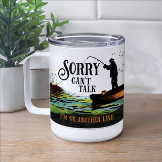 White travel mug with fisherman reading Sorry, I can't Talk, I'm on another line personalized with a name