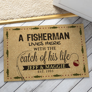 1/8" doormat with fishing graphic reading A fisherman lives here with the catch of his life personalized with your message