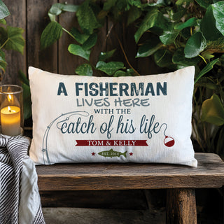 A lumbar pillow with fishing graphic reading A fisherman lives here with the catch of his life personalized with your message
