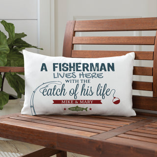 A lumbar pillow with fishing graphic reading A fisherman lives here with the catch of his life personalized with your message
