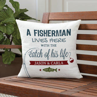 A 17" pillow with fishing graphic reading A fisherman lives here with the catch of his life personalized with your message